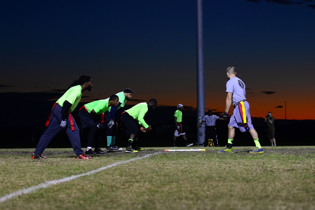 Members of the Ryan Center and 45th Intelligence Squadron teams play in the 2015 Intramural Football Championship at Langley Air Force Base, Va., Nov. 3, 2015. After competing against each other for more than an hour, the Ryan Center came out on top with a final score of 20 to 19. (U.S. Air Force Senior Airman Kimberly Nagle/Released)   