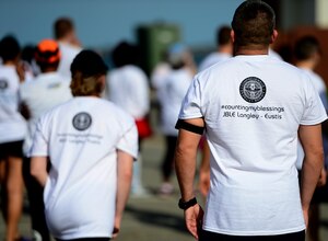 Participants stretch prior to the Joint Base Langley-Eustis Resiliency 5K Color Run at Langley Air Force Base, Va., Oct. 29, 2015. The run aimed to boost morale and promote healthy lifestyles for the JBLE community. (U.S. Air Force photo by Senior Airman Kayla Newman/Released)