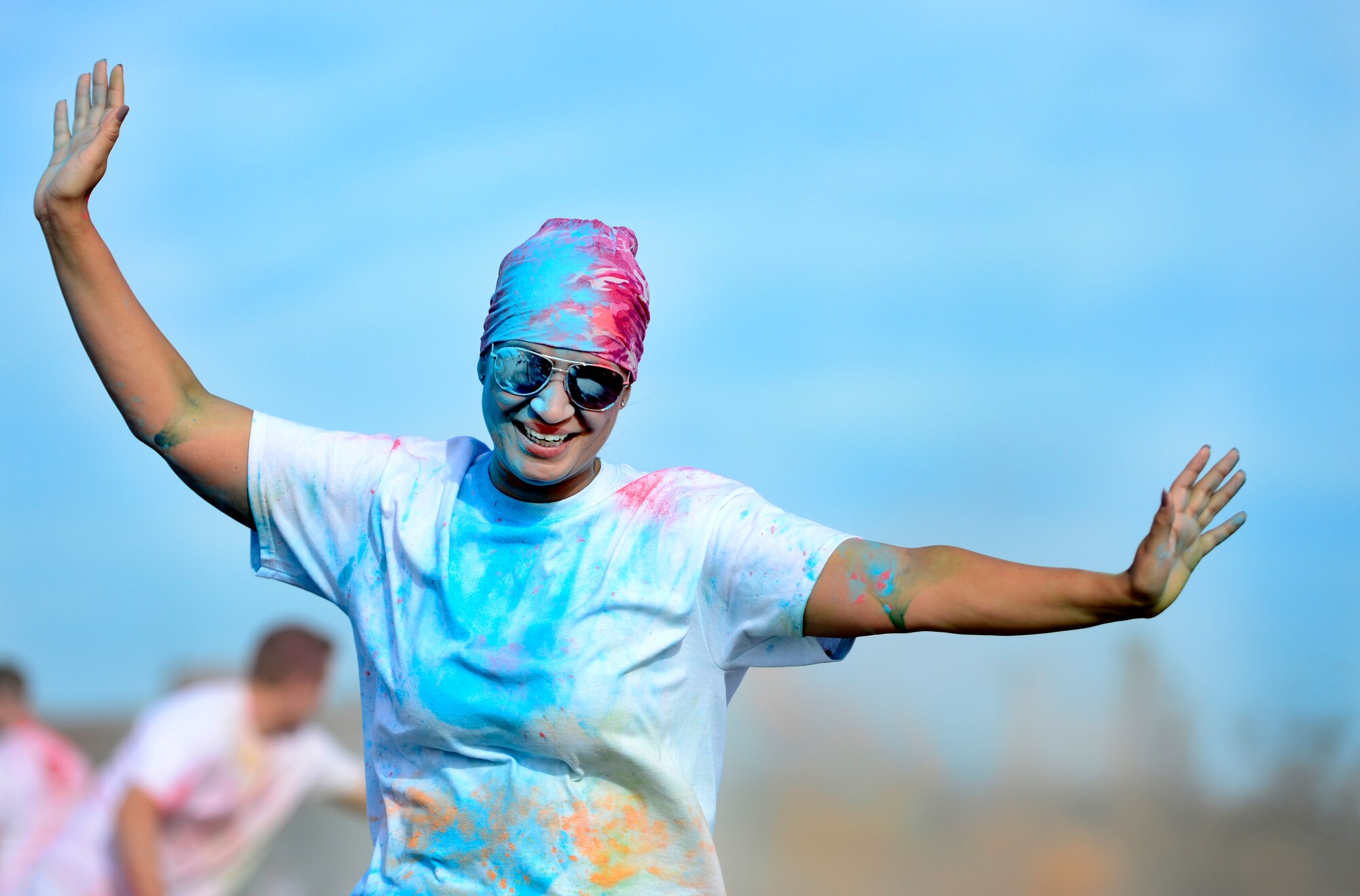 A runner participates in the Joint Base Langley-Eustis Resiliency 5K Color Run at Langley Air Force Base, Va., Oct. 29, 2015. Runners wore shirts highlighting Comprehensive Airman Fitness which promotes a resilient Air Force community that fosters mental, physical, social and spiritual fitness. (U.S. Air Force photo by Senior Airman Kayla Newman/Released)