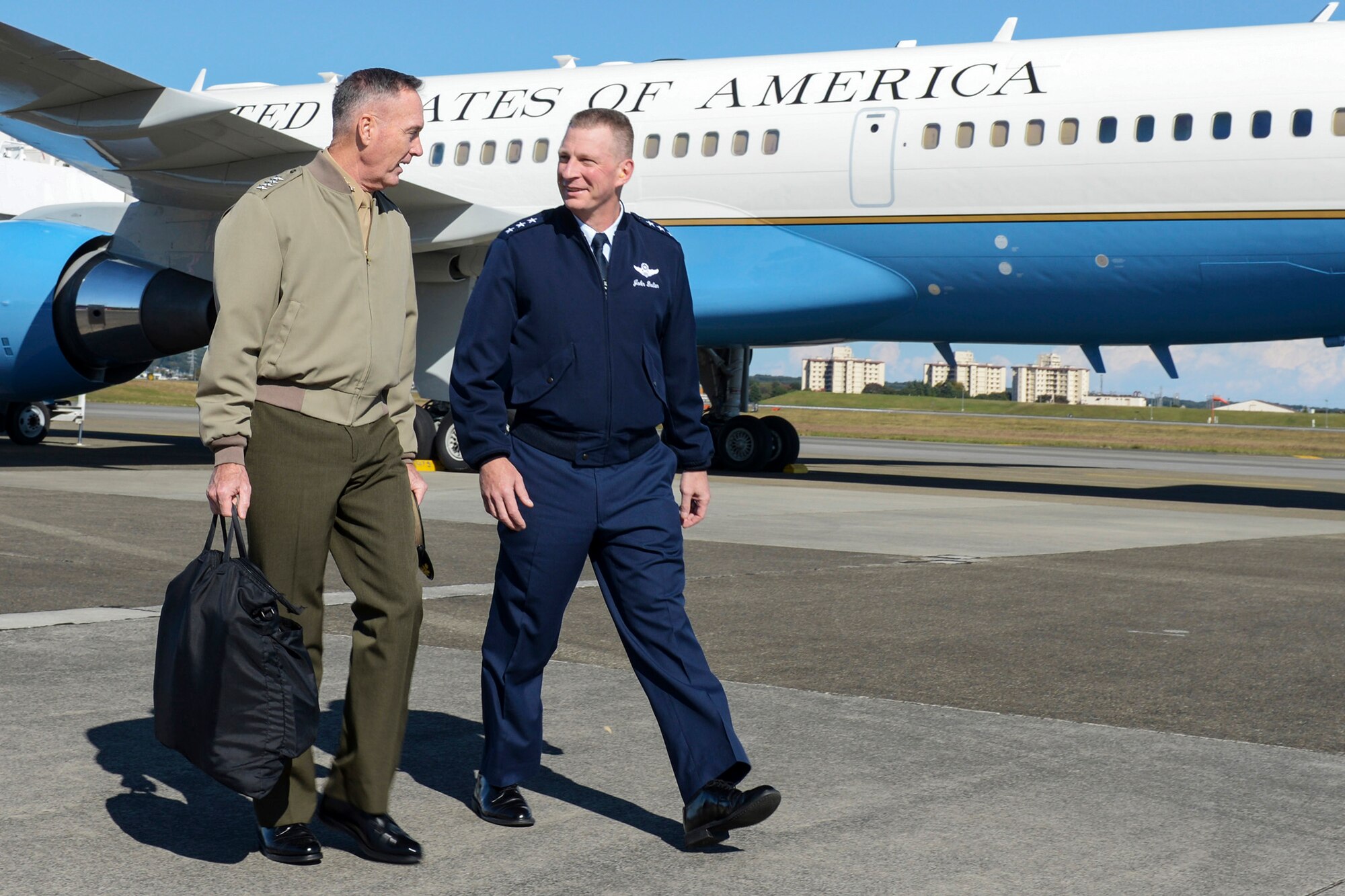 Marine Corps Gen. Joseph F. Dunford, the chairman of the Joint Chiefs of Staff, speaks
with Air Force Lt. Gen. John Dolan, U.S. Forces, Japan commander, during his visit to
Yokota Air Base, Japan, Nov. 3, 2015. The generals left Yokota to visit with members of
the Japan Self-Defense Forces and the U.S. Embassy in downtown Tokyo. (U.S. Air
Force photo by Staff Sgt. Cody H. Ramirez/Released)