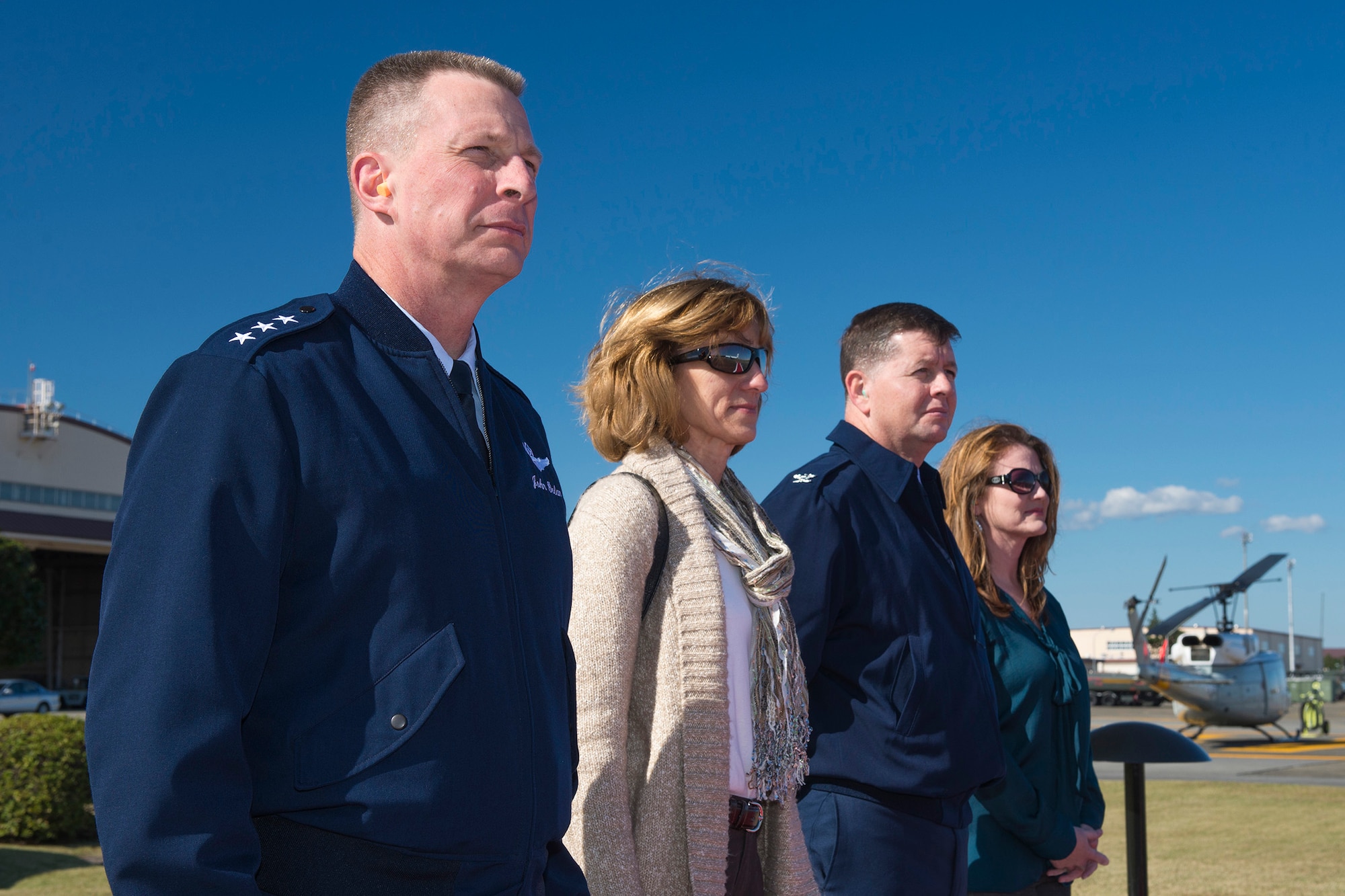 Air Force Lt. Gen. John Dolan, U.S. Forces, Japan commander, and his wife, Nancy,
and Col. Neil Richardson, 374th Airlift Wing vice commander, and his wife, Melissa, wait
for the arrival of the chairman of the Joint Chiefs of Staff at Yokota Air Base, Japan, Nov.
3, 2015. (U.S. Air Force photo by Staff Sgt. Cody H. Ramirez/Released)