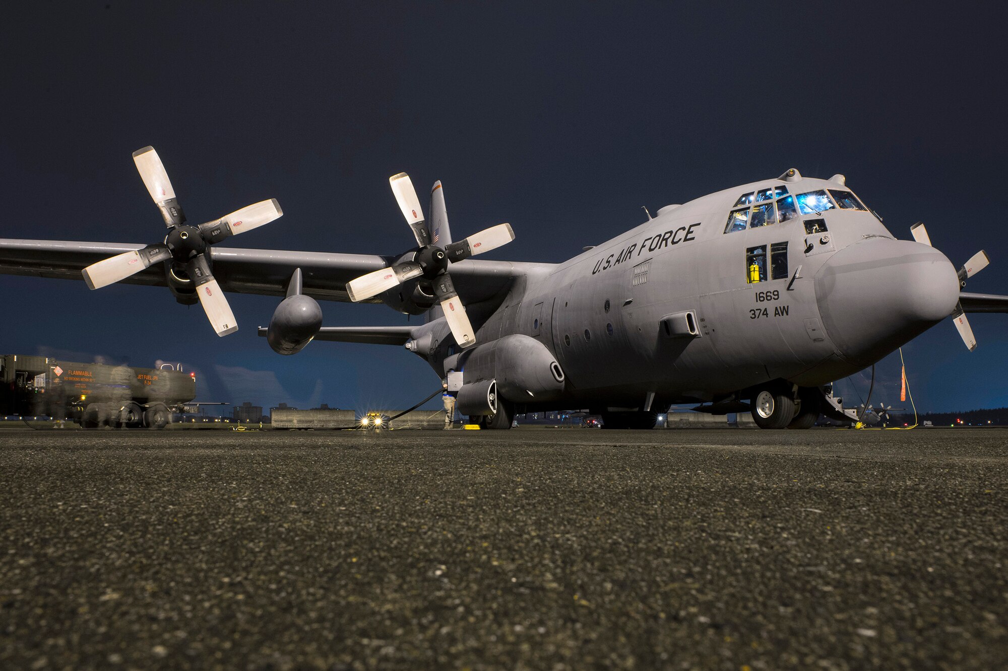 Airmen with the 374th Aircraft Maintenance Squadron and 374th Logistical Readiness Squadron fuel a C-130 Hercules during VIGILANT ACE 16 at Yokota Air Base, Japan, Nov. 2, 2015. Airmen prepped multiple C-130s to take part in operational flights during VIGILANT ACE 16, a U.S.-Republic of Korea combined exercise aimed at enhancing operational and tactical level coordination through combined and joint combat training. The exercise also provides critical training for the Airmen of the 374th Airlift Wing to maintain peace and stability in Japan and the entire Indo-Asia Pacific region.  (U.S. Air Force photo by Staff Sgt. Cody H. Ramirez/Released)
