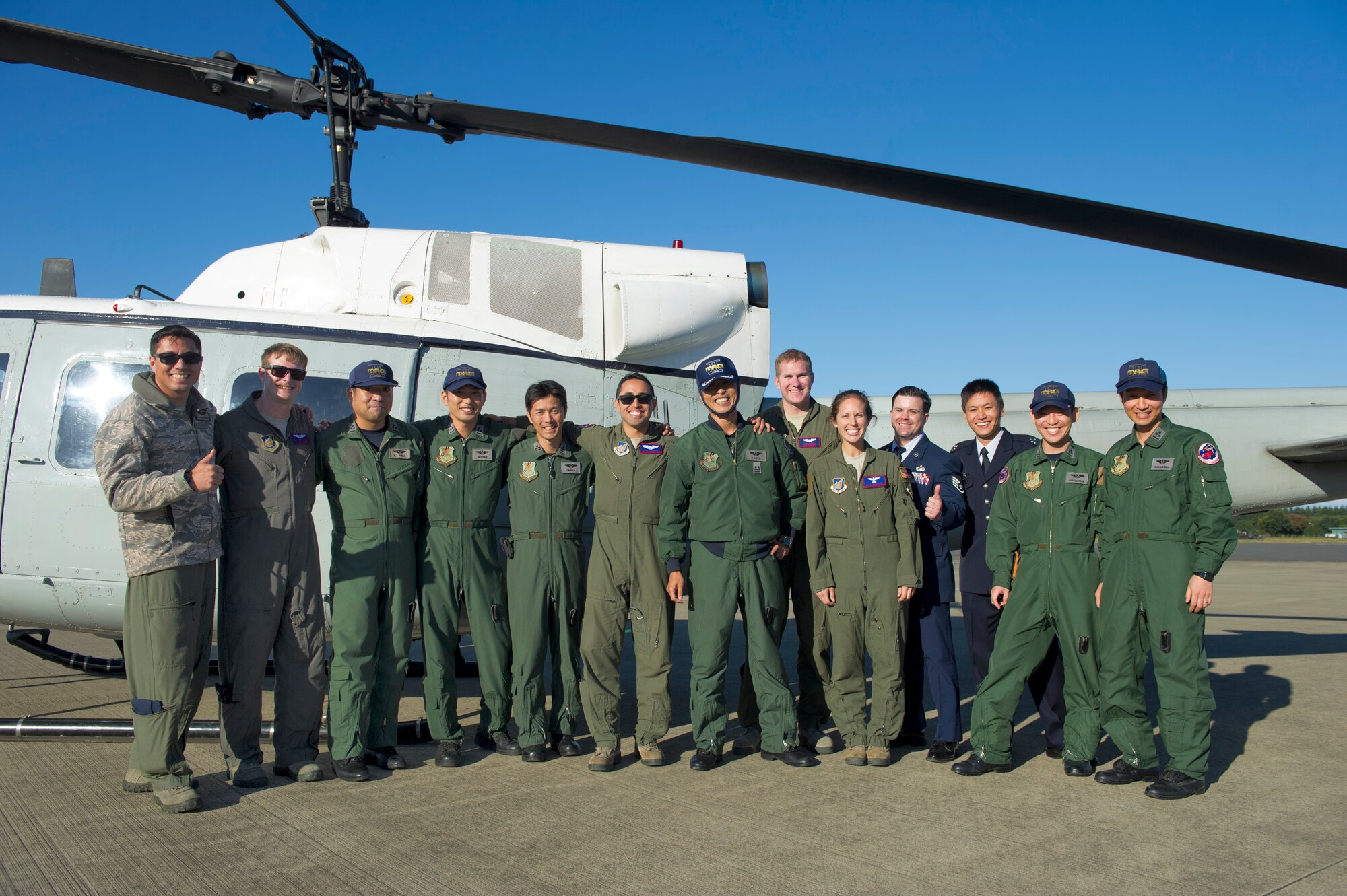 459th Airlift Squadron and Japan Air Self-Defense Force Airmen pose for a photo at Iruma Air Base, Japan, Nov. 3, 2015. The 459th Airlift Squadron’s participation in the annual air show allowed Yokota Airmen an opportunity to build relationships with their Japan Air Self-Defense Force partners and interact with the members of the local community. (U.S. Air Force photo by Airman 1st Class Delano Scott/Released)