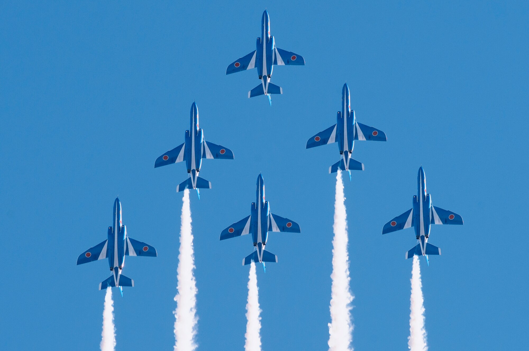 The Japan Air Self-Defense Force aerobatic team, Blue Impulse, fly in formation over Iruma Air Base, Japan, Nov. 3, 2015. Blue Impulse used the smoke-trails to sketch artistic patterns in the sky. (U.S. Air Force photo by Airman 1st Class Delano Scott/Released)