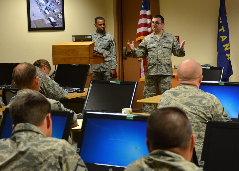 341st Missile Wing Staff Sgt. Rodney Bradley and Tech. Sgt. Jared Lingle conduct a bullet writing seminar for members of the Montana Air National Guard at the 120th Airlift Wing on Oct. 22, 2015. (U.S. Air National Guard photo by Senior Master Sgt. Eric Peterson/Released)