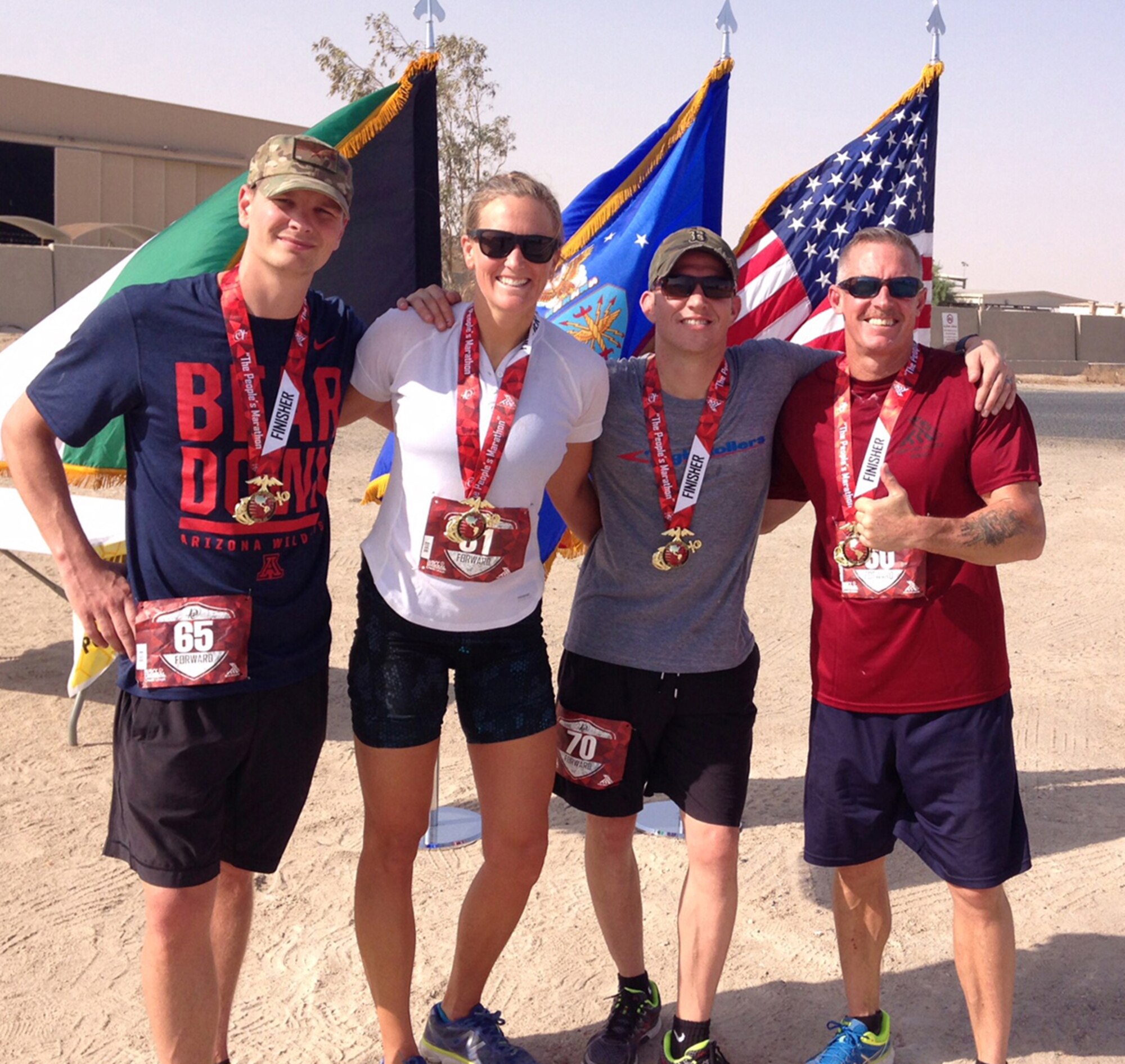 High Roller Deployers, (from left to right), Capt. Reed Kobernick, Capt. Merridy Stephenson, Master Sgt. Lyle Smith and Chief Master Sgt. Thomas Glover who all participated in the Marine Corps Marathon Forward. (Photo by a unnamed volunteer.)