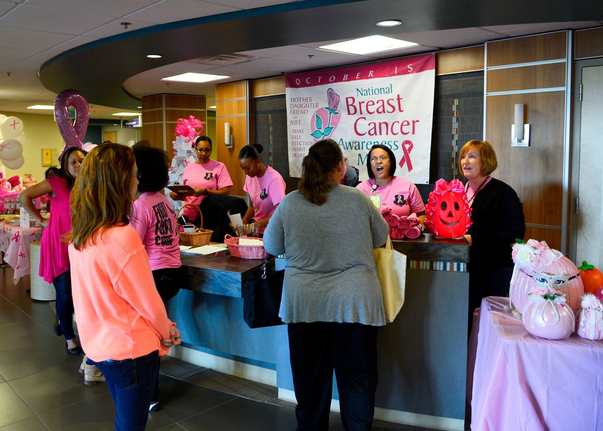 Team Dover members check-in at the Woman’s Health Event Oct. 30, 2015, at the 436th Medical Group Clinic on Dover Air Force Base, Del. The event was a P4 community partnership event that brought off-base agencies to the 436th MDG Clinic to interact with the Dover AFB community and spread awareness and education about breast cancer and other topics of women’s health. (U.S. Air Force photo/Senior Airman William Johnson)