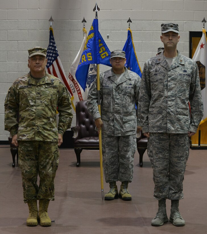 U.S. Army Col. William Galbraith, 733rd Mission Support Group commander, and U.S. Air Force Master Sergeant Michael Browning, 733rd Logistics Readiness Squadron first sergeant, and Maj. Ross Mol, 733rd LRS commander, stand at attention during a merger, activation and deactivation ceremony at Fort Eustis, Va., Nov. 2, 2015. During the ceremony Mol’s former squadron, the 633rd LRS was deactivated as he took command of the newly activated 733rd LRS. (U.S. Air Force photo by Staff Sgt. Natasha Stannard/Released)