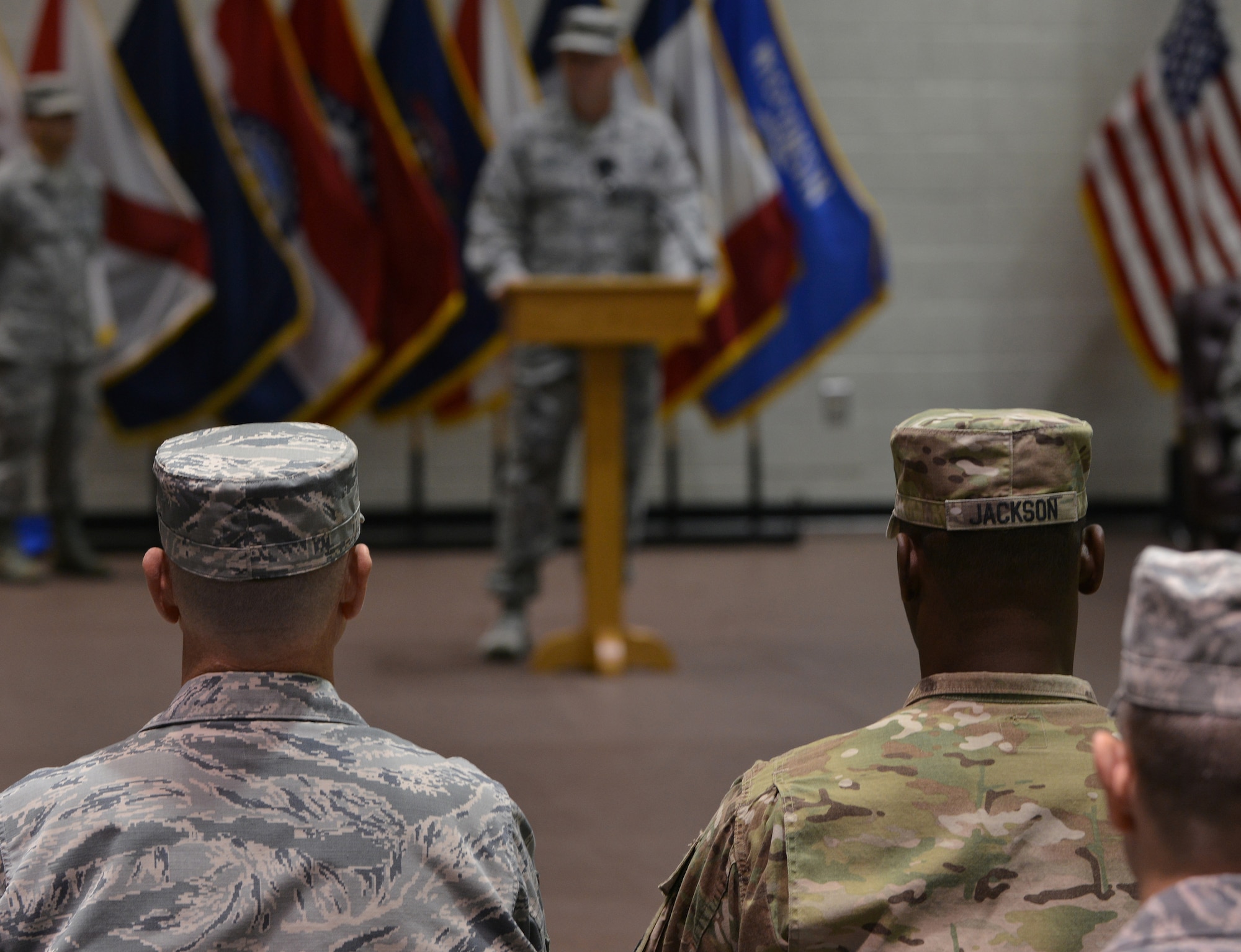 U.S. Army Soldiers and U.S. Air Force Airmen listen as Col. Kevin Head, 633rd Mission Support Squadron commander, speaks during a merger, activation and deactivation ceremony at Fort Eustis, Va., Nov. 2, 2015. The ceremony involved deactivating the 633rd Logistics Readiness Squadron and merging its personnel into the newly activated 733rd LRS; and merging the 733rd Force Support Division into the 633rd Force Support Squadron. (U.S. Air Force photo by Staff Sgt. Natasha Stannard/Released)