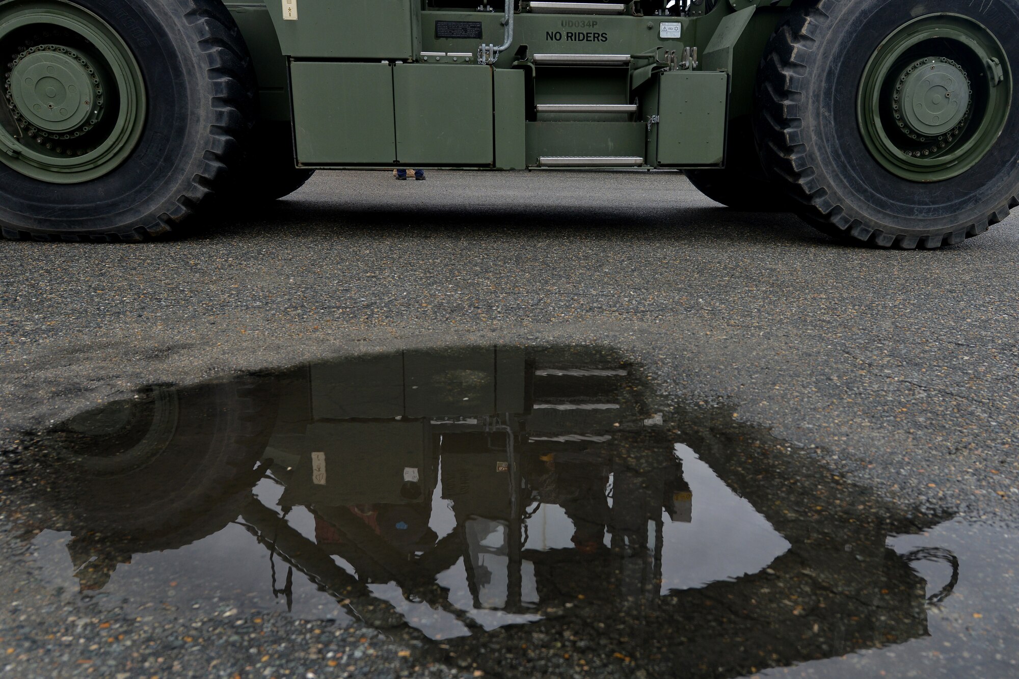 U.S. Army Maritime and Intermodal Training School students learn to operate and direct a rough terrain container handler at Fort Eustis, Va., Oct. 28, 2015. During the rough terrain container handler course, students interchanged roles of directing and operating the handlers as both skill sets are needed to accurately and safely stack the large and heavy cargo. (U.S. Air Force photo by Staff Sgt. Natasha Stannard/ Released)