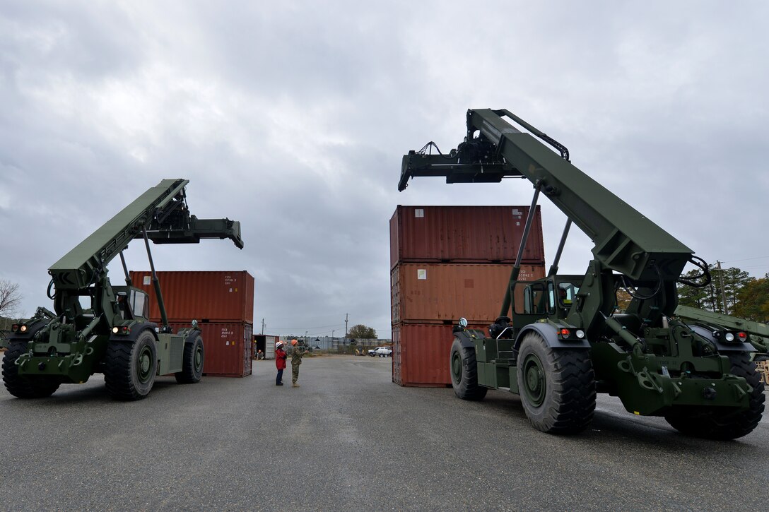 U.S. Army Maritime and Intermodal Training School students learn to stack large and heavy cargo during the rough terrain container handler course at Fort Eustis, Va., Oct. 28, 2015. Upon completion of the course, students will be able to contribute new skills sets that enable the movement of heavy equipment and cargo. (U.S. Air Force photo by Staff Sgt. Natasha Stannard/ Released)