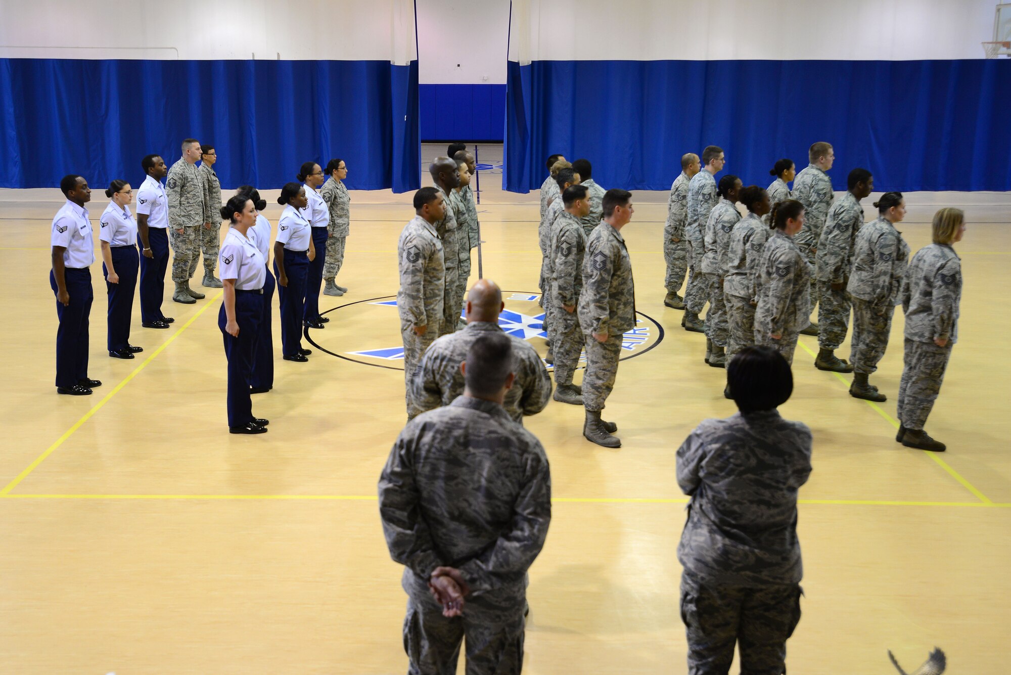 Competitors in a drill-off competition participate in an elimination round at Langley Air Force Base, Va., Oct. 28, 2015. U.S. Air Force Service members from Langley Top Three, Langley Club 5/6 and the Langley Airmen Committed to Excellence organizations participated in the event, which was held to boost morale. (U.S. Air Force photo by Senior Airman Kimberly Nagle/Released)