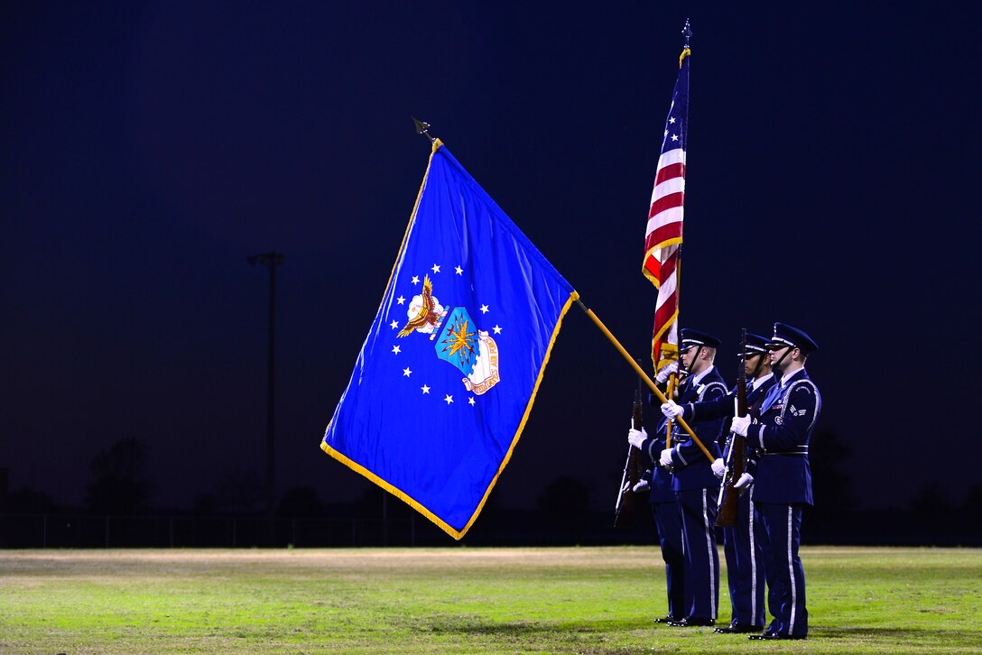 U.S. Air Force Langley Honor Guard Airmen present the colors prior to the 2015 Intramural Football Championship at Langley Air Force Base, Va., Nov. 3, 2015. After 19 teams competed for more than three months in weekly intramural games, the 45th Intelligence Squadron and Ryan Center teams faced off in the championship game. (U.S. Air Force Senior Airman Kimberly Nagle/Released)   