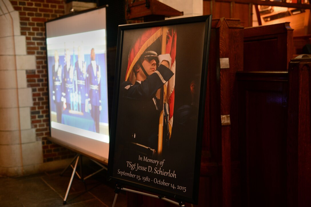 Photos honoring U.S. Air Force Tech. Sgt. Jesse Schierloh were on display during a memorial service at Langley Air Force Base, Va., Oct. 29, 2015. Schierloh, a native of California, entered the Air Force in 2004 and died Oct. 14, 2015. (U.S. Air Force photo by Airman 1st Class Derek Seifert/ Released)