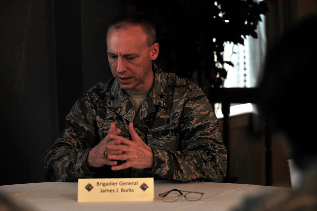 U.S. Air Force Brig. Gen. James Burks, director of Manpower, Personnel and Resources and Chief of the Medical Service Corps, Office of the Air Force Surgeon General, speaks with company grade officers during a ‘Stars and Bars’ event at Langley Air Force Base, Va., Oct. 29, 2015. The CGO Council hosted their first ‘Stars and Bars’ in hopes to make networking connections between the officer tiers. (U.S. Air Force photo by Senior Airman Breonna Veal/ Released)