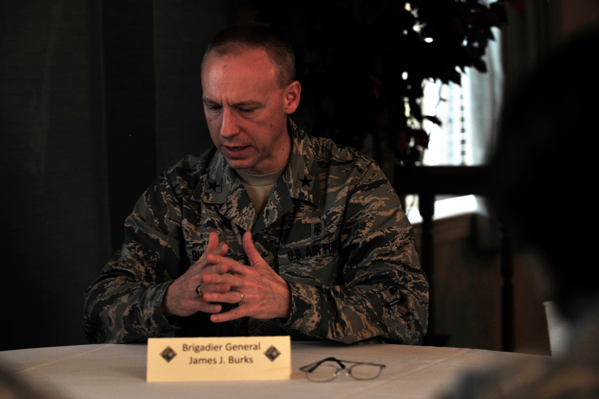 U.S. Air Force Brig. Gen. James Burks, director of Manpower, Personnel and Resources and Chief of the Medical Service Corps, Office of the Air Force Surgeon General, speaks with company grade officers during a ‘Stars and Bars’ event at Langley Air Force Base, Va., Oct. 29, 2015. The CGO Council hosted their first ‘Stars and Bars’ in hopes to make networking connections between the officer tiers. (U.S. Air Force photo by Senior Airman Breonna Veal/ Released)