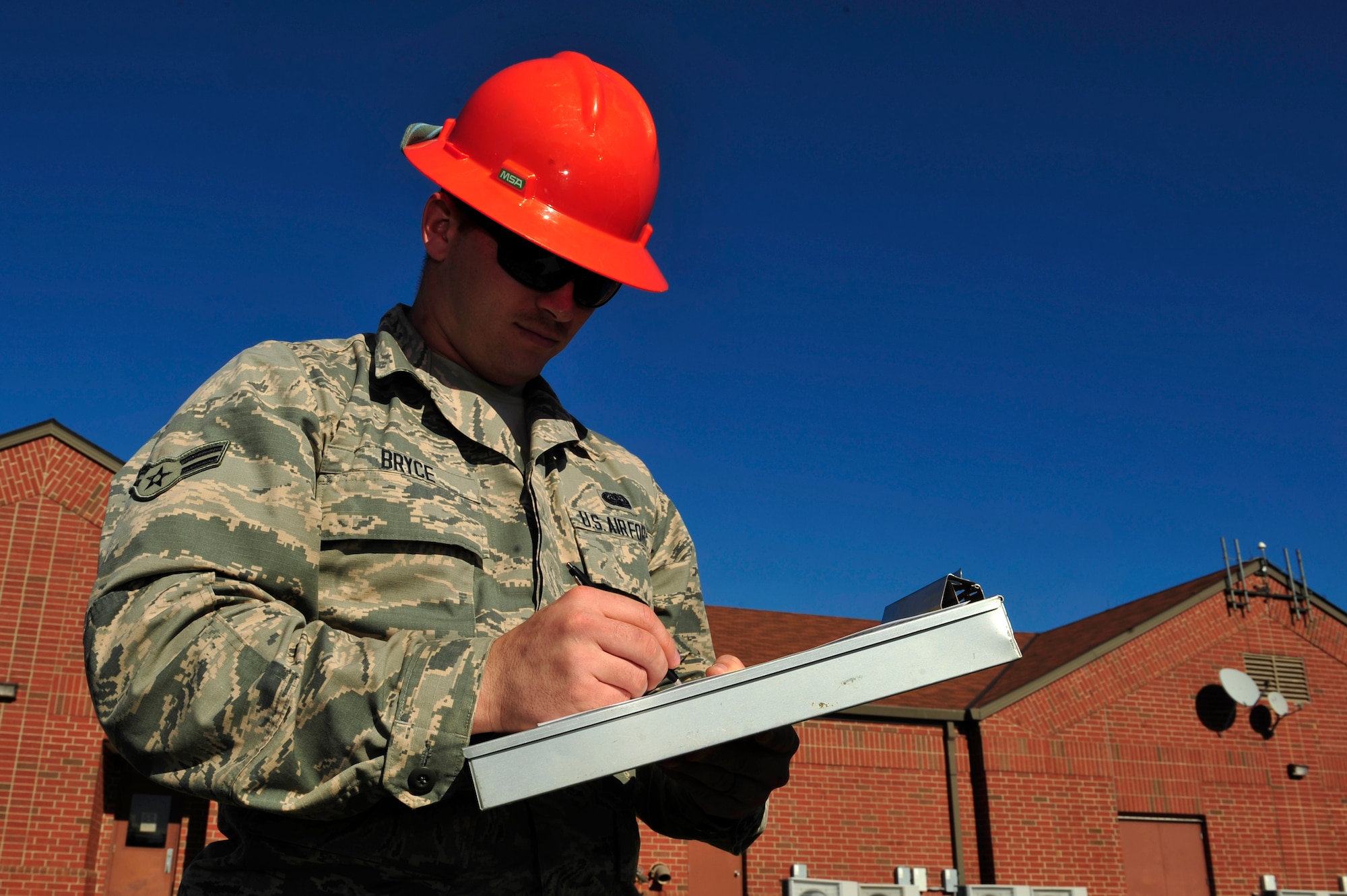 U.S. Air Force Airman 1st Class Ebby Bryce, 633rd Communications Squadron cable and antenna maintainer, logs work completed on a manhole at Langley Air Force Base, Va., Nov. 3, 2015. To ensure the safety of all qualified Airmen who enter and exit a manhole, Bryce uses the log to annotate the details of the maintenance completed on the manhole. (U.S. Air Force photo by Senior Airman Breonna Veal/Released)