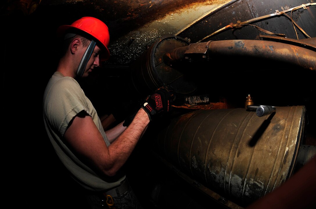 U.S. Air Force Airman 1st Class Zackery Dwyer, 633rd Communications Squadron cable and antenna maintainer, performs preventative maintenance on a splice case  at Langley Air Force Base, Va., Nov. 3, 2015. A splice case holds fiber and copper wires which are used to provide networking for the entire base. (U.S. Air Force photo by Senior Airman Breonna Veal/Released)
