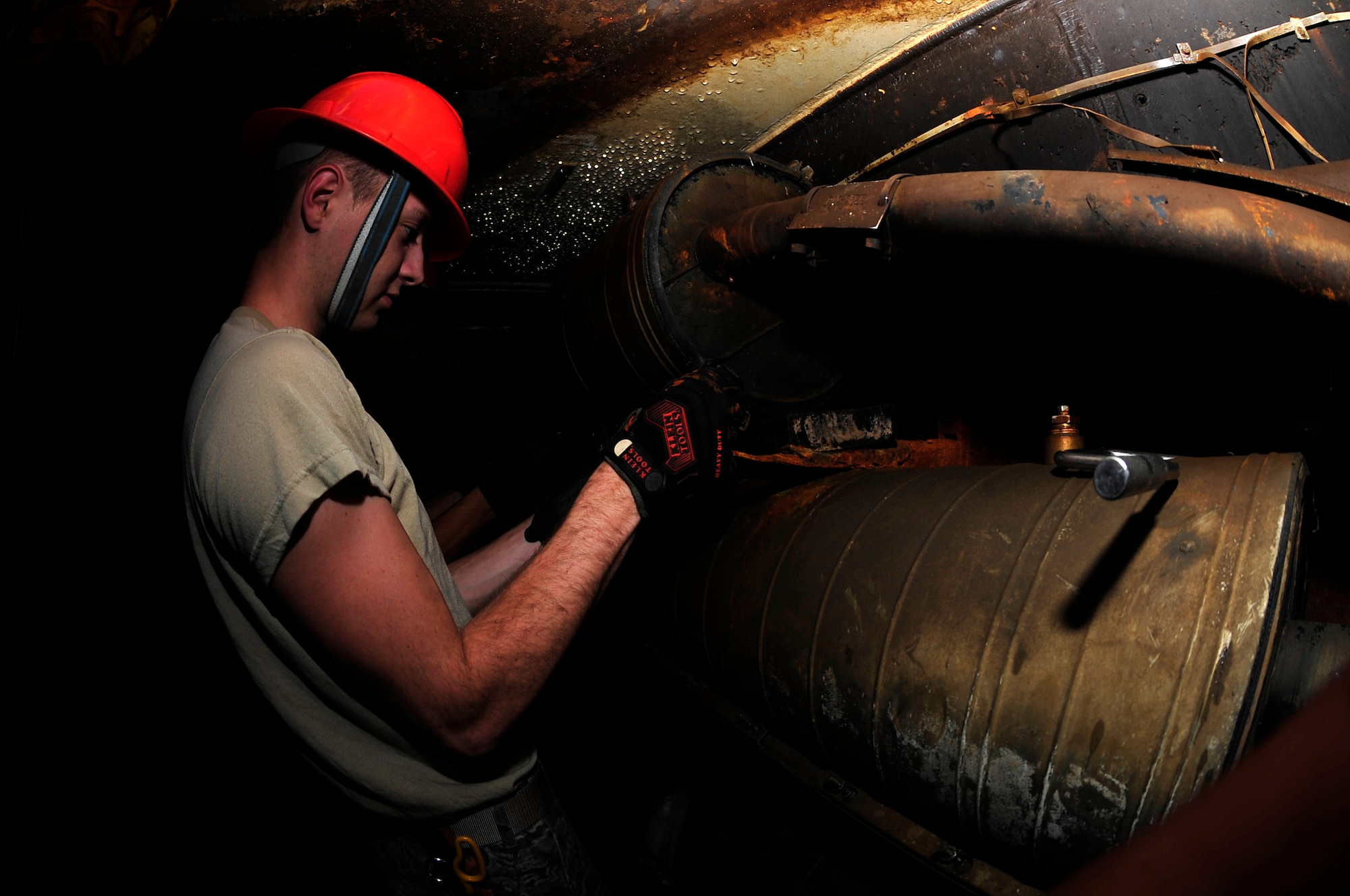 U.S. Air Force Airman 1st Class Zackery Dwyer, 633rd Communications Squadron cable and antenna maintainer, performs preventative maintenance on a splice case  at Langley Air Force Base, Va., Nov. 3, 2015. A splice case holds fiber and copper wires which are used to provide networking for the entire base. (U.S. Air Force photo by Senior Airman Breonna Veal/Released)