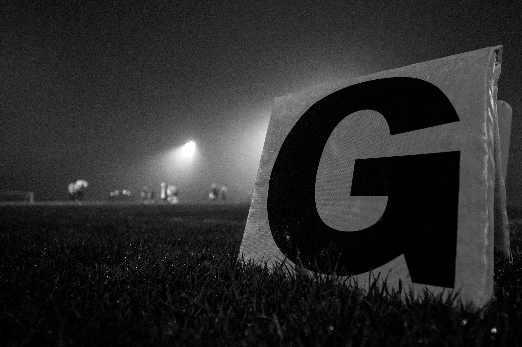 A goal line marker is displayed on the field during the 2015 Intramural Flag Football Championship game at Spangdahlem Air Base, Germany, Nov. 3, 2015. Both 52nd Civil Engineer Squadron and 52nd Communications Squadron Intramural Flag Football teams found the end zone frequently despite the foggy weather. (U.S. Air Force photo by Senior Airman Rusty Frank/Released)