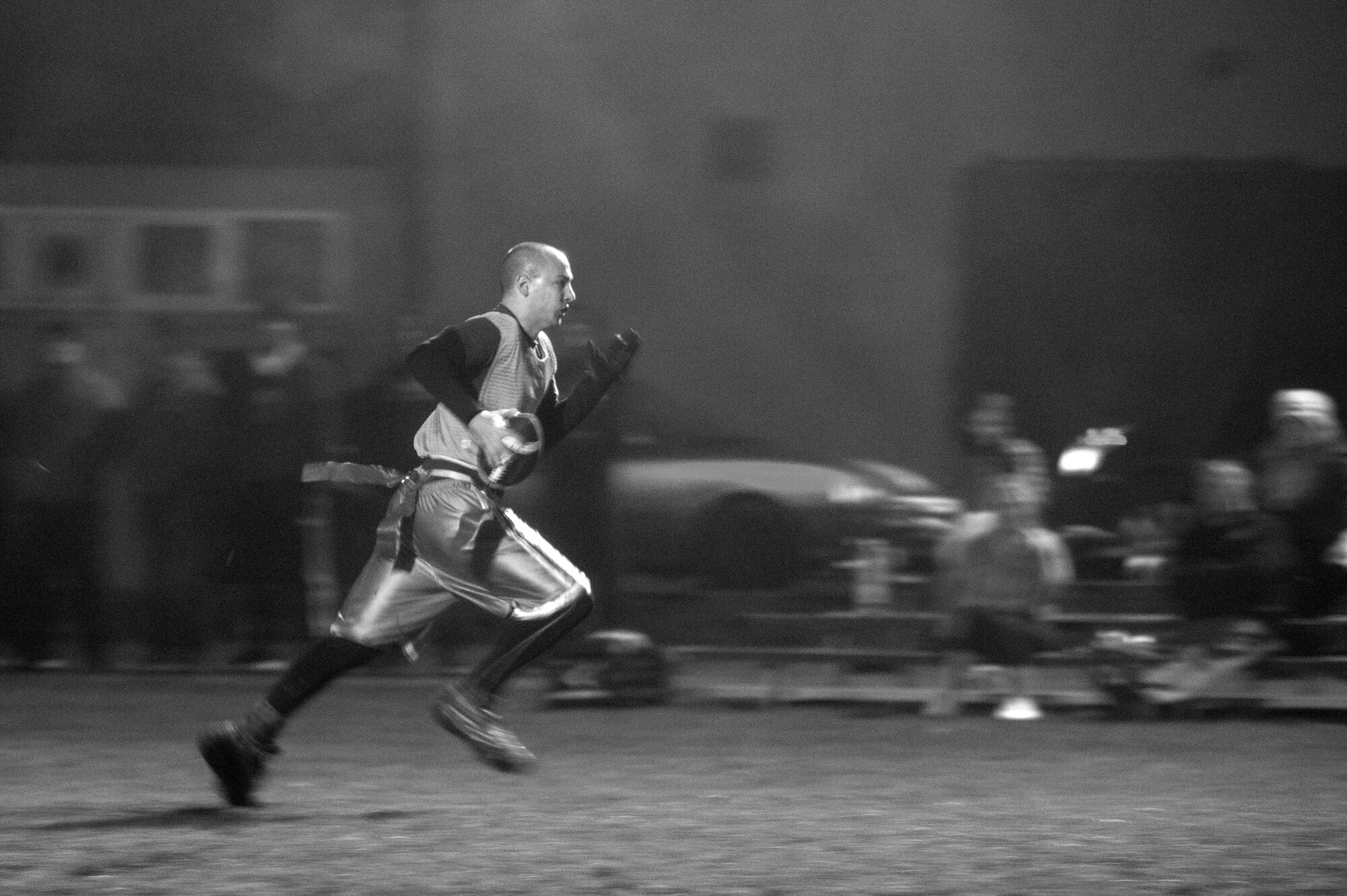 A member of the 52nd Communications Squadron Intramural Flag Football team runs during the 2015 Intramural Flag Football Championship game Nov. 3, 2015 at Spangdahlem Air Base, Germany. The 52nd CS forced overtime, but ultimately lost the game with a score of 20-19. (U.S. Air Force photo by Senior Airman Rusty Frank/Released)