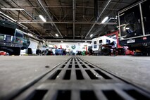 509th Logistics Readiness Squadron (LRS) vehicle maintainers perform maintenance on government vehicle in the maintenance garage at Whiteman Air Force Base, Mo., Oct. 26, 2015. The mission of the 509th LRS vehicle maintainers is to perform daily maintenance, body work and upholstery repairs to vehicles to ensure they are fully operational. (U.S. Air Force photo by Tech. Sgt. Miguel Lara III/Released)