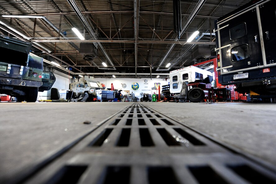 509th Logistics Readiness Squadron (LRS) vehicle maintainers perform maintenance on government vehicles in the maintenance garage at Whiteman Air Force Base, Mo., Oct. 26, 2015. The mission of the 509th LRS vehicle maintainers is to perform daily maintenance, body work and upholstery repairs to vehicles to ensure they are fully operational. (U.S. Air Force photo by Tech. Sgt. Miguel Lara III/Released) 