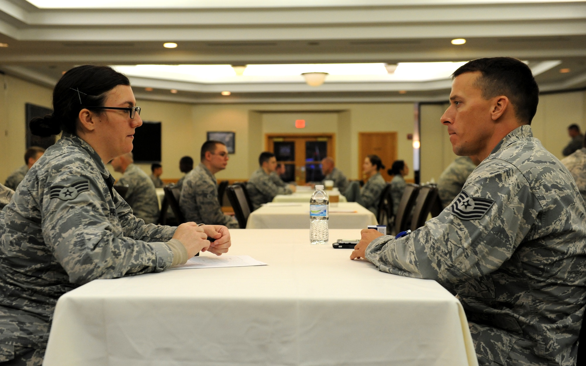 Airmen discuss career concerns with NCOs and senior NCOs during a speed-mentoring event at Whiteman Air Force Base, Mo., Oct. 30, 2015. The event was centered on supplying junior enlisted Airmen with a one-on-one mentoring session discussing subjects such as retraining or assignments. (U.S. Air Force photo by Tech. Sgt. Miguel Lara III/Released)