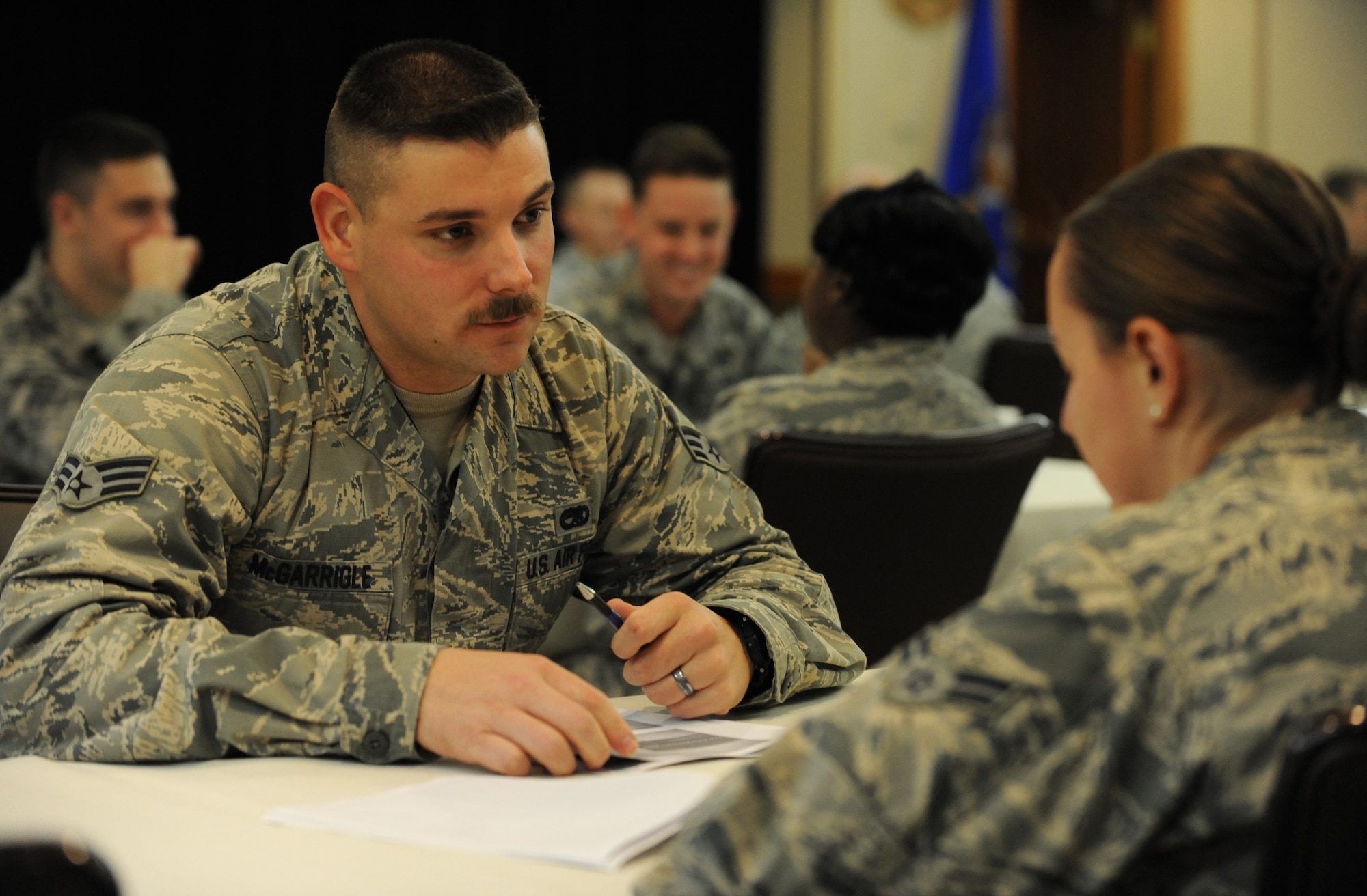 U.S. Air Force Senior Airman Ryan McGarrigle, 509th Operations Support Squadron low observable aircraft structural maintainer, discusses Air Force issues during a speed-mentoring event at Whiteman Air Force Base, Mo., Oct. 30, 2015. The event was centered on supplying junior enlisted Airmen with a one-on-one mentoring session discussing subjects such as retraining or assignments. (U.S. Air Force photo by Tech. Sgt. Miguel Lara III/Released)