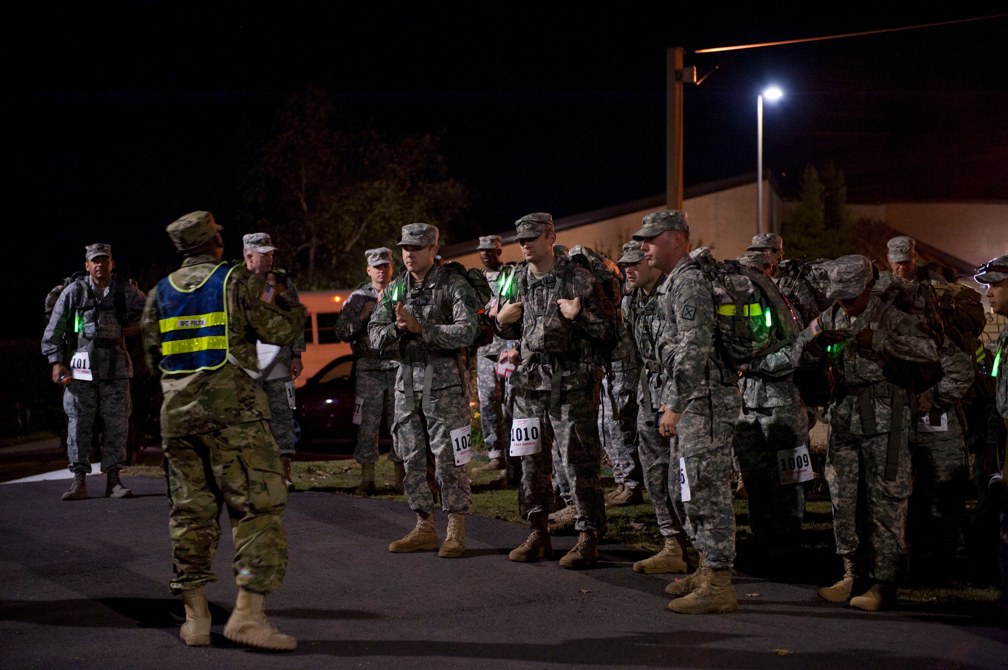 Camp Robinson and Team Little Rock members listen to a safety briefing before competing in the 18.6-mile Norwegian Foot March Oct. 30, 2015, on Camp Robinson in Little Rock, Ark.  (U.S. Air Force photo by Senior Airman Stephanie Serrano)