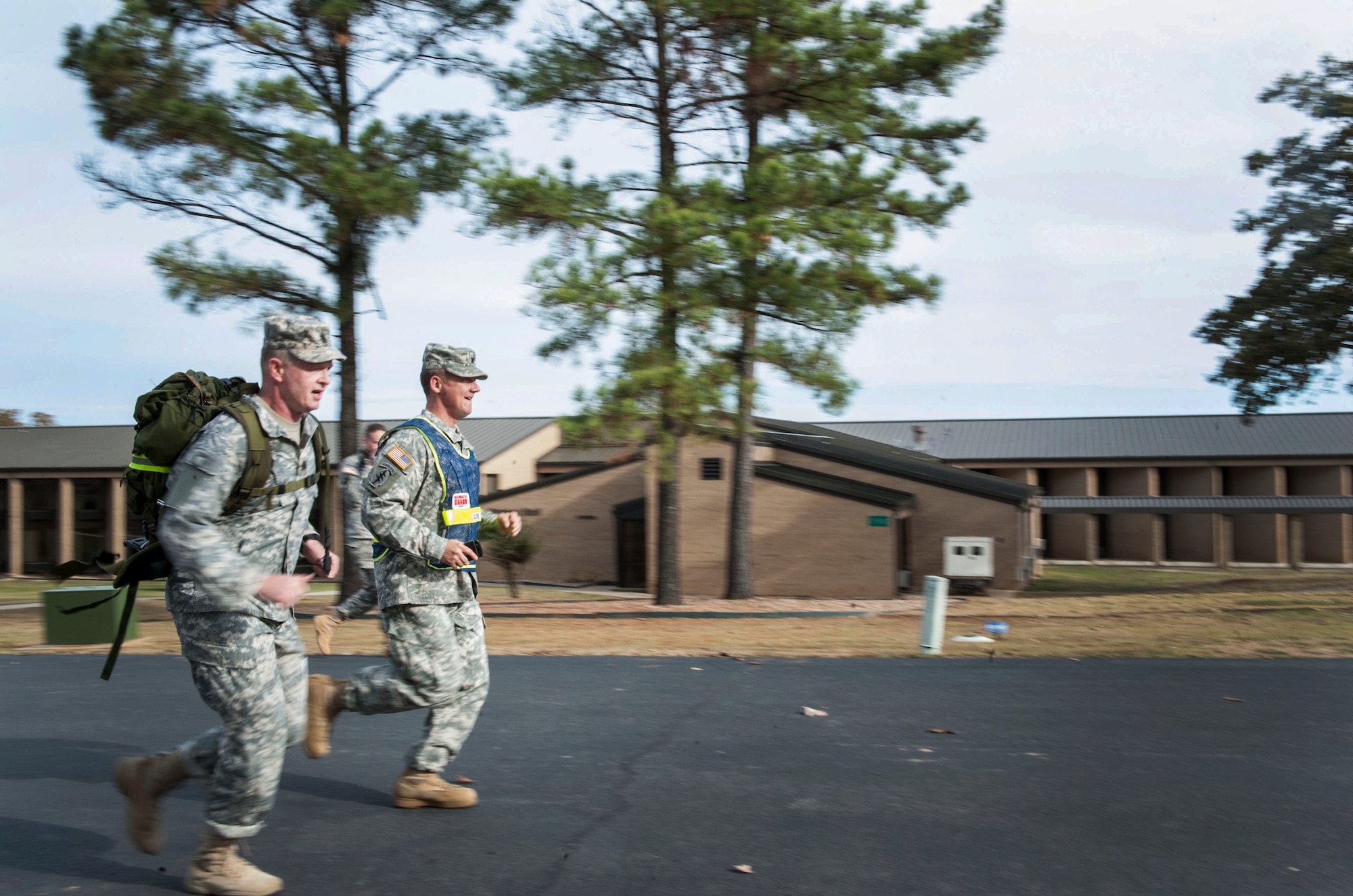 U.S. Army Col. Douglas Rose runs alongside U.S. Army Command Sgt. Major Gregory Slater to the finish line of the Norwegian Foot March Oct. 30, 2015, on Camp Robinson in Little Rock, Ark. Slater finished first with a time of 3 hours and 26 minutes. (U.S. Air Force photo by Senior Airman Stephanie Serrano)