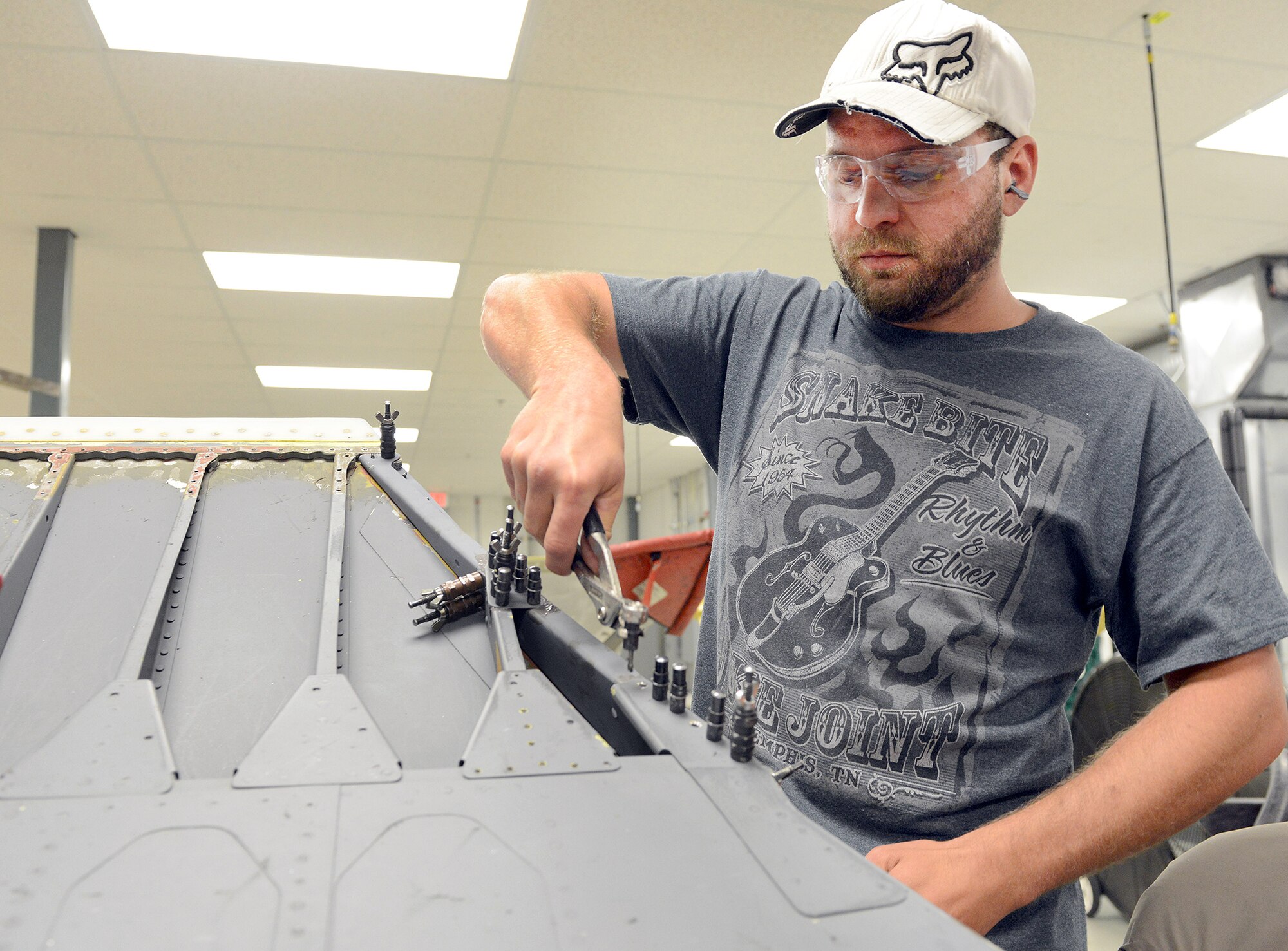 Harley Deal, 569th Aircraft Maintenance Squadron sheet metal mechanic, performs rib repair on a C-5 Galaxy slat. The C-5 Galaxy is one of the largest aircraft in the world and the largest airlifter in the Air Force inventory. The aircraft can carry a fully equipped, combat-ready military unit to any point in the world on short notice and then provide the supplies required to help sustain the fighting force. Robins provides depot maintenance on the C-5. (U.S. Air Force photo by Tommie Horton)
