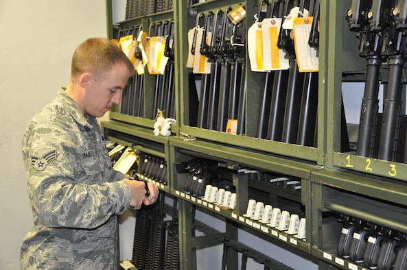 Senior Airman Cameron Mansfield, 88th Security Forces Squadron CATM instructor, is one of seven CATM instructors here. In all, they provide maintenance for 2,458 base weapons as part of their duties as CATM instructors. (U.S. Air Force photo/Bryan Ripple.)