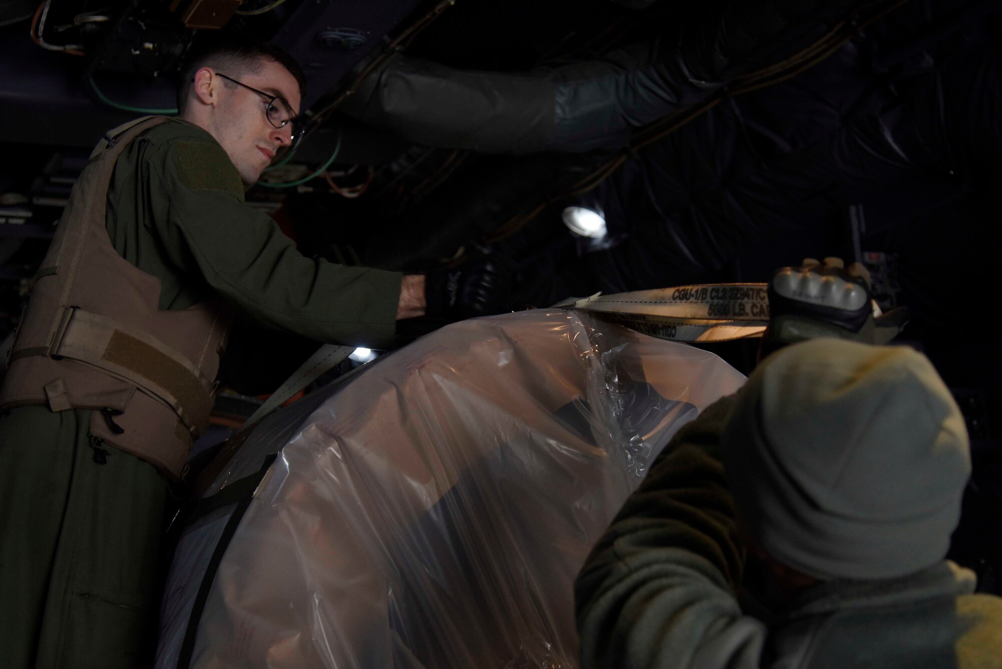 U.S. Air Force Senior Airman Jarred Johns, 36th Airlift Squadron load master, loads cargo into the back of a C-130 Hercules from Yokota Air Base, Japan, in support of exercise Vigilant Ace 16 at Misawa Air Base, Japan, Nov. 2, 2015. Several C-130s were flown in from Yokota, AB, where they provided transportation for more than 300 personnel to Osan Air Base, Korea. (U.S. Air Force photo by Airman 1st Class Jordyn Fetter/Released)