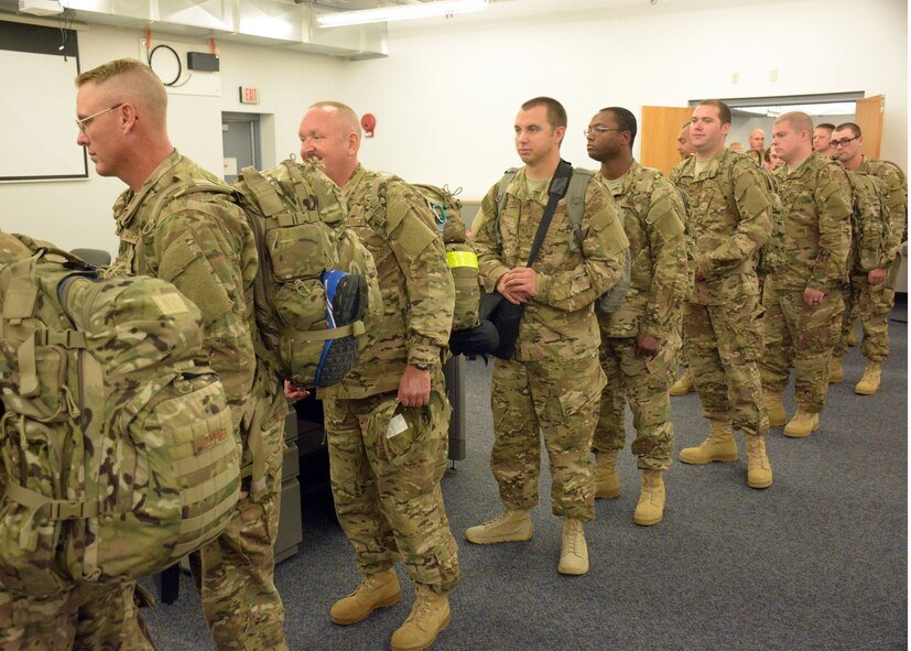 219th Rapid Engineer Deployable Heavy Operational Repair Squadron Engineer (RED HORSE) Squadron members complete their final processing at Malmstrom Air Force Base, Mont., prior to deploying to the United States Central Command area of operations Oct. 3, 2015. The Montana Air National Guard personnel will conduct military engineering projects during the deployment. (U.S. Air National Guard photo by Senior Master Sgt. Eric Peterson/Released)