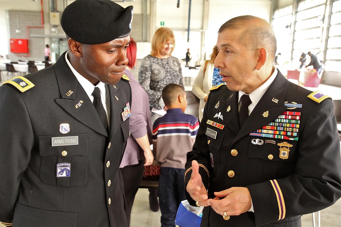 Col. Miguel Castellanos, right, commander of the 361st Civil Affairs brigade, talks to Lt. Col. U.L. Armstrong, new commander of the 773rd Civil Support Team after the 773rd change of command ceremony Oct. 30, 2015 in Halle, Belgium. (Photo by Staff Sgt. Rick Scavetta, 7th Mission Support Command public affairs office)