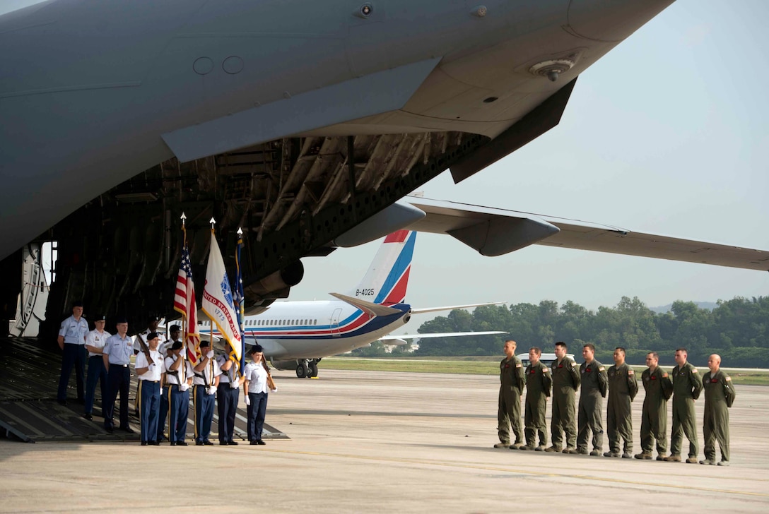 Members of a joint color guard and U.S. Air Force aircrew participate in a repatriation ceremony fpr the remains of a recovered American World War II era aircrew in Subang, Malaysia, Nov. 5, 2015. U.S.  Defense Secretary Ash Carter attended the event. DoD photo by U.S. Air Force Senior Master Sgt. Adrian Cadiz