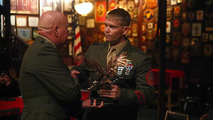 Staff Sgt. Mark W. Damm with Marine Corps Forces, Special Operations Command, receives the John Archer Lejeune Award for Bravery during the American Hero Awards Oct. 28, 2015, in Jacksonville, N.C. Damm was awarded for his actions during a mission in Afghanistan, when he led an 84-man assault that repelled numerous enemy attacks while Afghan police realigned security checkpoints. Damm directed friendly forces during numerous engagements and repeatedly exposed himself to enemy fire, ultimately saving friendly lives and successfully completing the mission.
