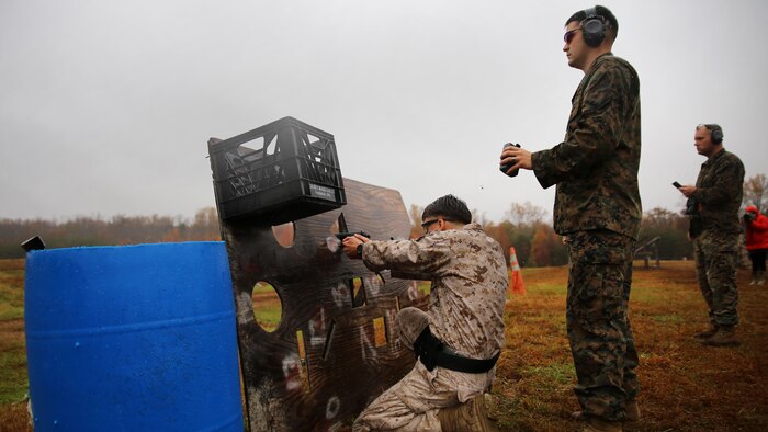 A Marine shoots an M9 Beretta down range on Stage 6 of the 2015 Combat Shooting Match on Marine Corps Base Quantico, Oct. 26-30. The Quantico Shooting Team invited Marines from all over the east coast to attend this combat shooting match which required the Marines to plan, think and react quickly with several different weapons on each of the six combat stages. (U.S. Marine Corps photo by Cpl. Kathy Nunez)
