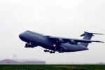 A C-5 Galaxy aircraft assigned to the 167th Airlift Wing, takes off from Shepherd Field, Martinsburg, W. Va., Oct. 19, 2011. The aircraft was the seventh aircraft to launch from the unit as part of an Air Force wide "surge" exercise for the C-5 fleet. The exercise, which was testing the United States Transportation Command's ability to rapidly provide strategic airlift in support of contingencies around the world, took place Oct. 17 to 21 and included 41 C-5 aircraft from the Air Force active, Reserve, and Guard
components.