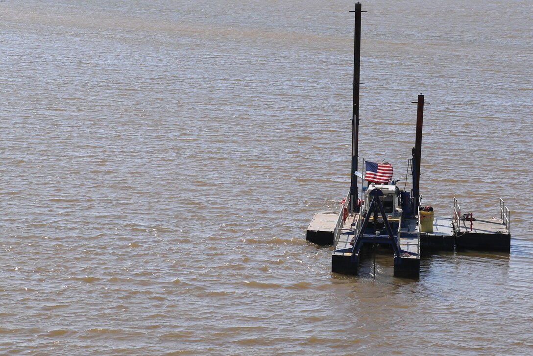 A working barge dredges sediment from the bottom of Waurika Lake, November 3. The dredging operation will last several months and will remove nearly 80,000 cubic yards of sediment that has built up along the intake channel of Waurika Lake since its impoundment in 1977.