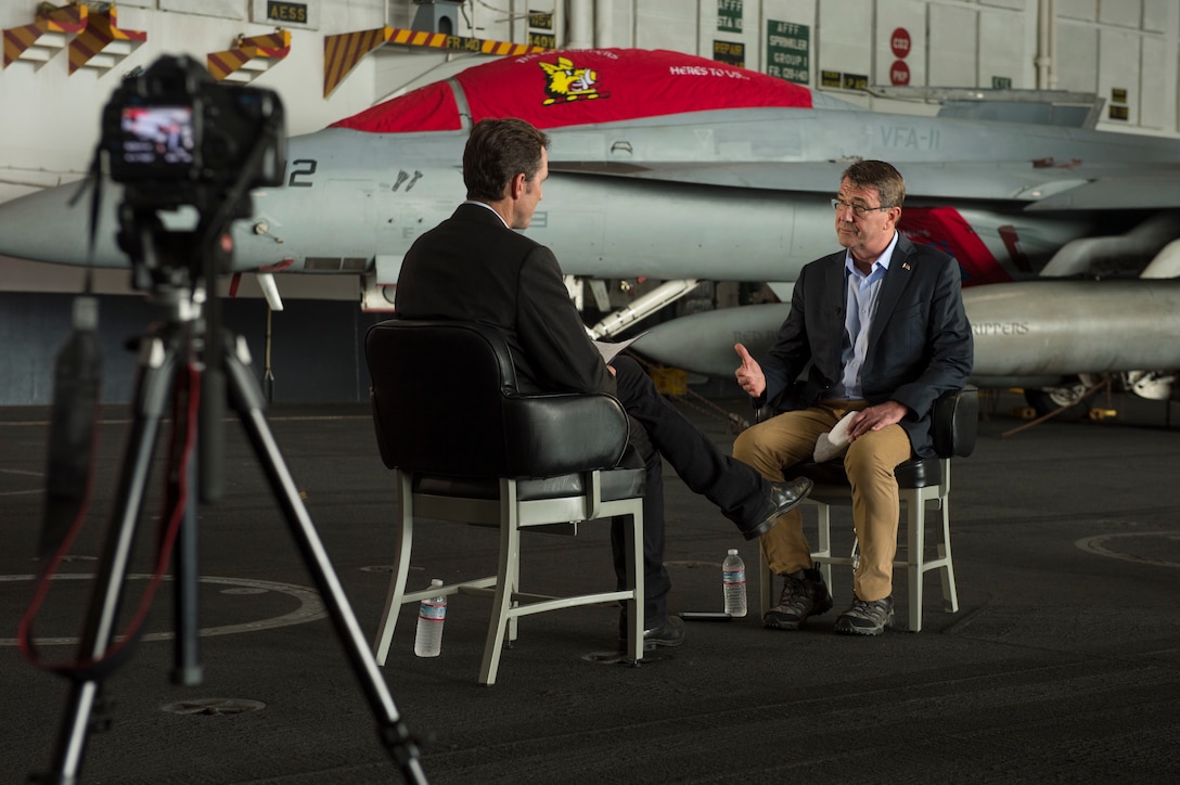 U.S. Defense Secretary Ash Carter, right, answers questions during an interview with reporter Bob Woodruff during a visit to the USS Theodore Roosevelt at sea, Nov. 5, 2015. DoD photo by Air Force Senior Master Sgt. Adrian Cadiz
