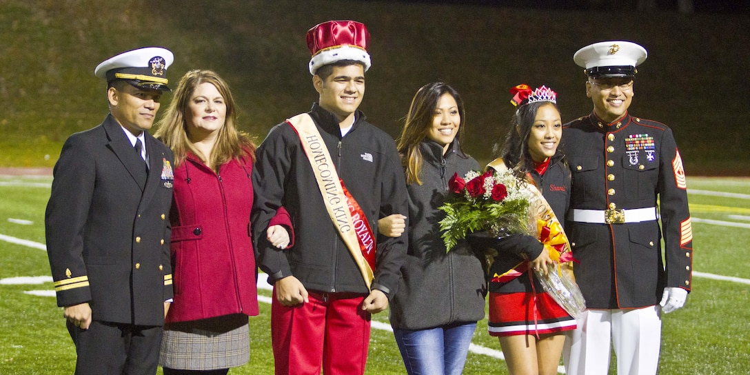 Quantico Middle/High School crowns their homecoming queen and king Oct. 30 at Butler Stadium aboard Marine Corps Base Quantico. The winners and their parents Lt. Wilfredo Lucas Jr., Naval Health Clinic Quatico, Mannie Lucas, Cameron Lucas, Homecoming King, Shanette Pagaragan, Shanel Pagaragan , Homecoming Queen, Master Gunnery Sgt. Elmer Pagaragan were honored during halftime of the homecoming game, where the team dueled against Grace Christian High School from Staunton, Va. 
