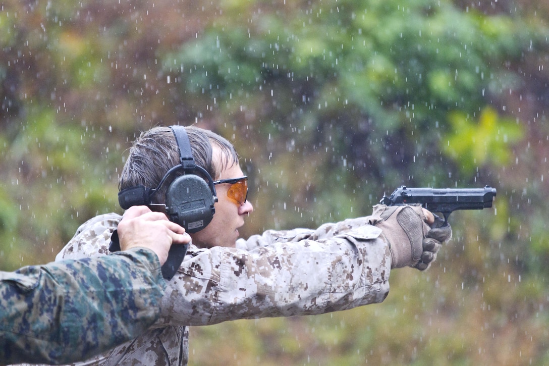 Cpl. David Dudley, Expeditionary Air Field, uses proper eye and ear protection during the 5th annual Combat Shooting Competition Oct. 28, hosted by Weapons Training Battalion aboard Marine Corps Base Quantico.