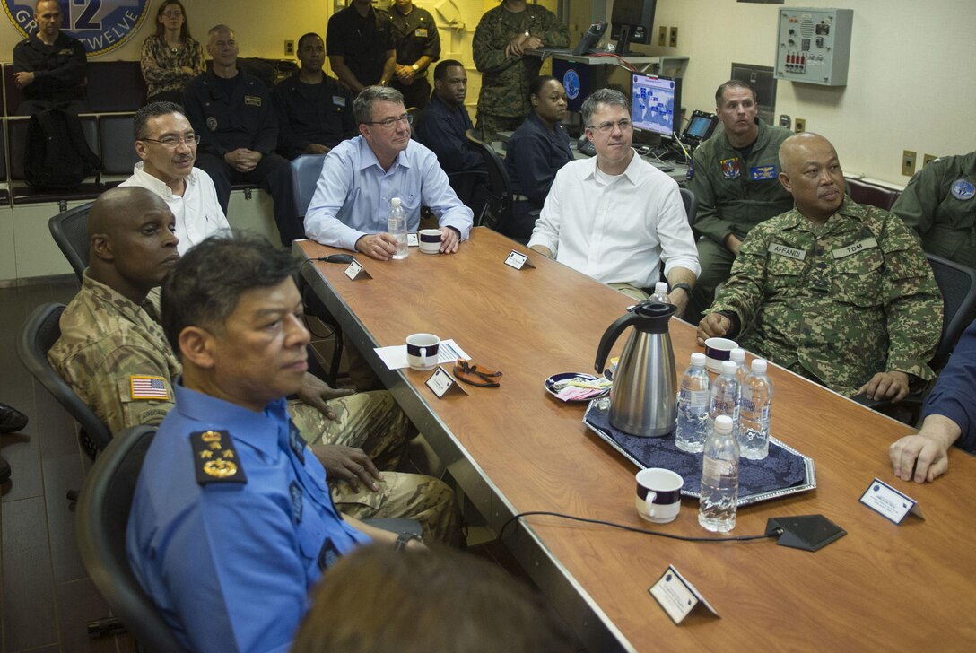 U.S Defense Secretary Ash Carter and Malaysian Defense Minister Hishammuddin Hussein and their staffs listen to a briefing on the capabilities of the USS Theodore Roosevelt during a visit to the aircraft carrier, Nov. 5, 2015. DoD photo by Air Force Senior Master Sgt. Adrian Cadiz