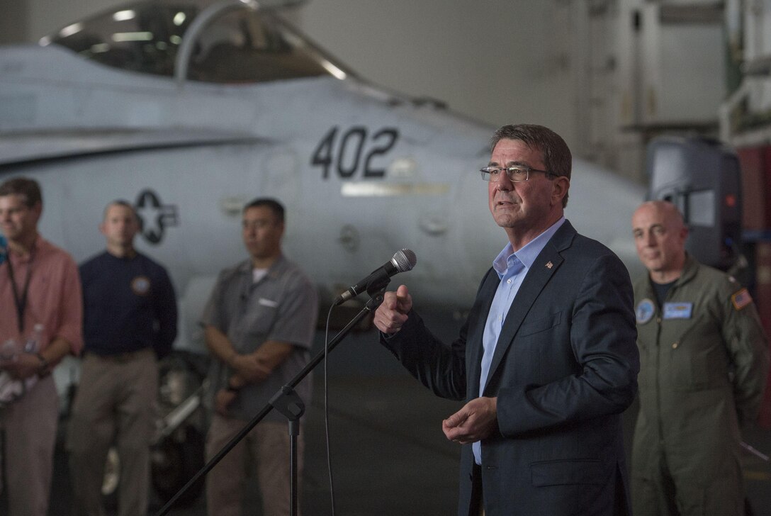 U.S Defense Secretary Ash Carter speaks with U.S. service members on the USS Theodore Roosevelt  as he and Malaysian Defense Minister Hishammuddin Hussein visit the aircraft carrier Nov. 5, 2015. DoD photo by Air Force Senior Master Sgt. Adrian Cadiz