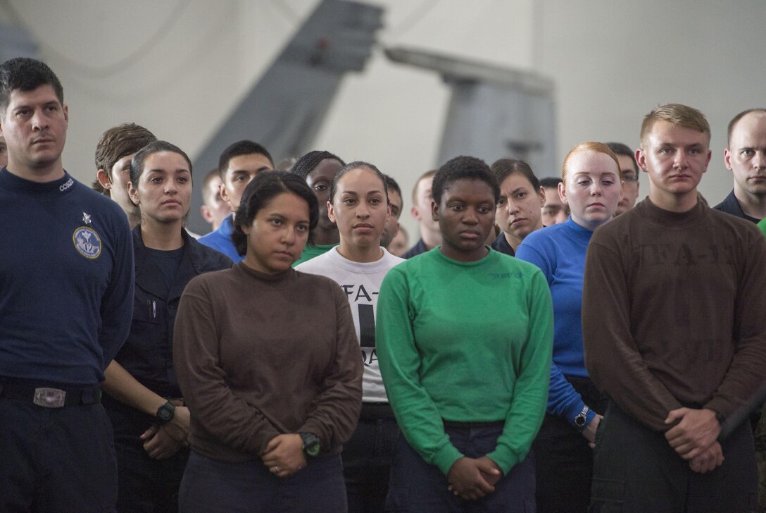 U.S. service members listen as U.S Defense Secretary Ash Carter speaks with them on the USS Theodore Roosevelt  as he and Malaysian Defense Minister Hishammuddin Hussein visit the aircraft carrier Nov. 5, 2015. DoD photo by Air Force Senior Master Sgt. Adrian Cadiz