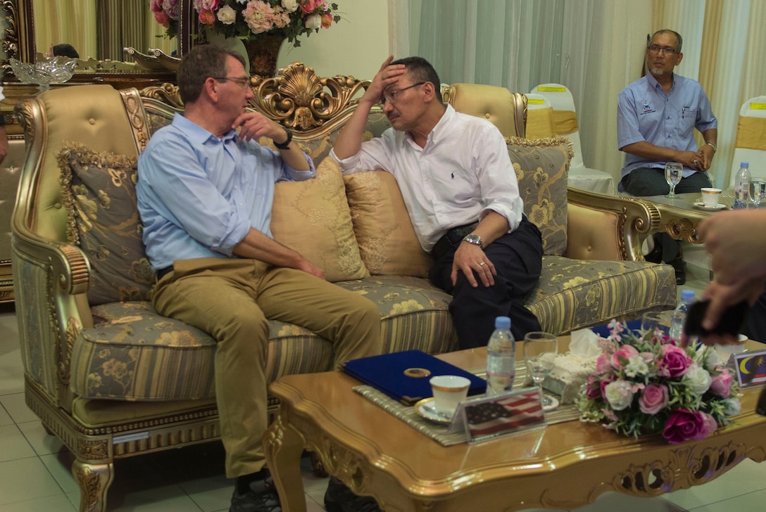 U.S. Defense Secretary Ash Carter, left, speaks with Malaysian Defense Minister Hishammuddin Hussein during a visit to Sepanggar Naval Base, Malaysia, Nov. 5, 2015. Both leaders met to discuss matters of mutual importance. DoD photo by Air Force Senior Master Sgt. Adrian Cadiz