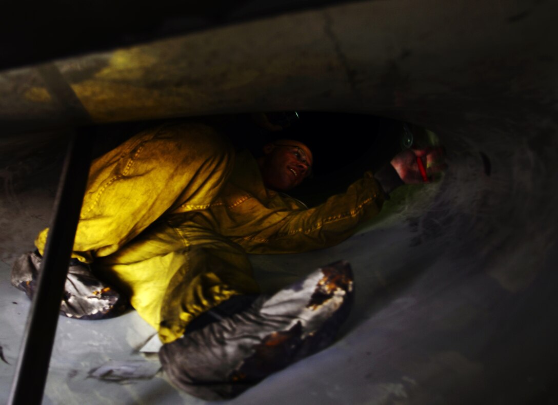 Staff Sgt. Joseph Musil, 36th Aircraft Maintenance Unit crew chief, climbs inside the intake of an F-16 Fighting Falcon assigned to the 36th Fighter Squadron Nov. 4, 2015, at Osan Air Base, Republic of Korea. Members of the 36th AMU are participating in the large-scale readiness exercise Vigilant Ace 16. Throughout Vigilant Ace 16, maintenance crews work around the clock to ensure precision combat aircraft are able to meet exercise demands. Vigilant Ace 16 is designed to enhance the interoperability of the U.S. and Republic of Korea Air Forces. (U.S. Air Force photo/Staff Sgt. Benjamin Sutton)