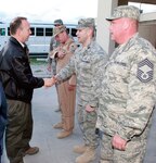 Delaware Governor Jack Markell, left, meets Delaware Airmen at Bagram Air Base, Afghanistan on Nov. 16, 2011. To the left of the governor is Air Force Col. Mike Feeley, deputy operations group commander, 455th Air Expeditionary Wing, Bagram Air Base, Afghanistan, and commander, 166th Operations Group, 166th Airlift Wing, Delaware Air National Guard. Governor Markell and Connecticut Governor Dannel Malloy spent a day in one nation in Southwest Asia and two days in Afghanistan meeting troops from their respective states.